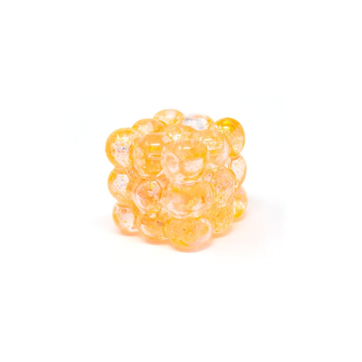 Bubblegum’s Favorite Toy - Glitter Bubble Cube is a translucent orange glass cube composed of small, round, bubble-like spheres fused together, displayed on a white background.