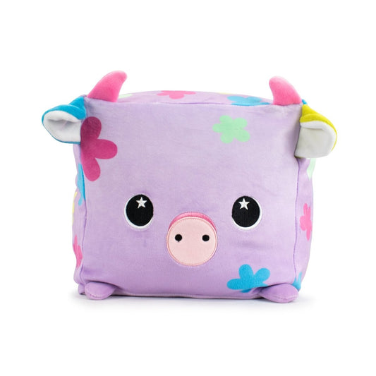 The cube-shaped Pasquale the Cow Plushie features a cow face with sensory softness, a pink snout, and shiny eyes. This predominantly purple toy has colorful flower patterns, small ears and feet. Perfect for Easter plushie fans, it's machine washable for easy care.