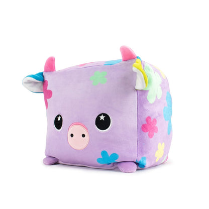 Pasquale the Cow Plushie is a cube-shaped, light purple plush with a cute cow design featuring colorful floral patterns, pink and blue horns, black eyes, and a small snout. This machine washable Easter plush is perfect for cuddling with its sensory softness!.