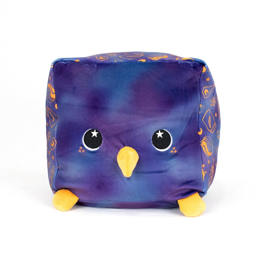 Paul the Black Bird is a plush, cube-shaped toy with a galaxy-patterned ultra-soft body, big starry embroidered eyes, yellow beak and feet, orange space-themed side designs, and is machine washable for easy care.