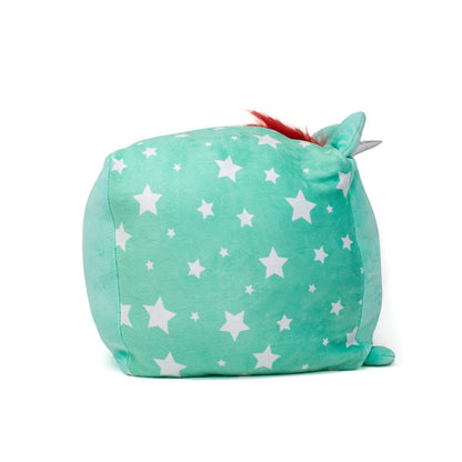 The Pepper Plushie is a mint green cube toy with a white star pattern, small ears, a red tuft of hair, and tiny feet, resembling a whimsical character. It is posed on a plain white background.