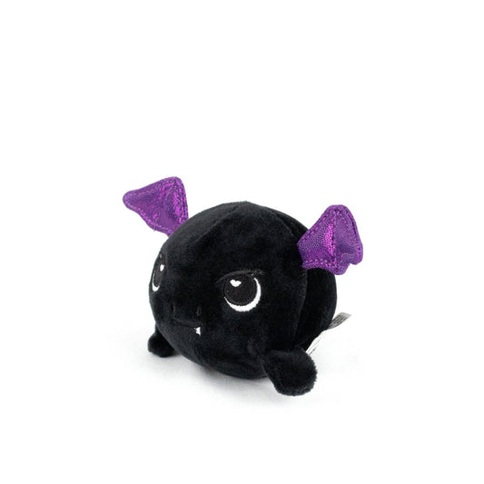The Kai Spooky Plushy Skwishy is a round, black plush toy with embroidered eyes, small white fangs, and shiny purple bat wings, shown sitting on a white background.