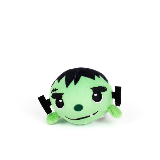 The Frankie Spooky Plushy Skwishy is a round, cute green monster plush with black hair, stitched eyebrows, a scar, and small black and green ears, styled to look like a cartoon Frankenstein's monster.