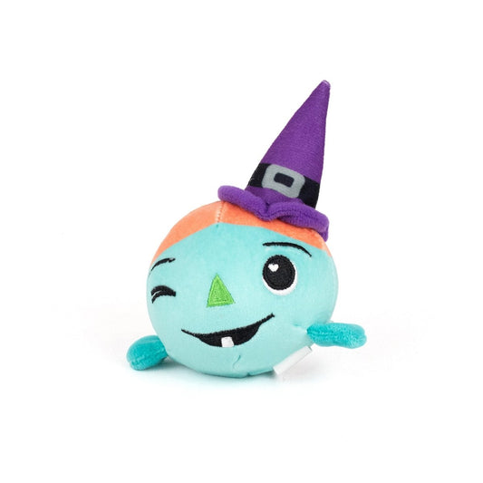 Asha Spooky Plushy Skwishy is a round, blue-green plush toy with one arm, a winking face, single tooth, triangular nose, and wears a purple pointed witch hat with a black belt and silver buckle.