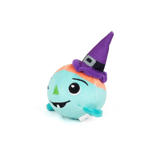 Asha Spooky Plushy Skwishy is a round, teal plush toy with a smiling face, small fangs, green triangular nose, and wears a tall purple witch hat with a black band and gray buckle. The background is plain white.