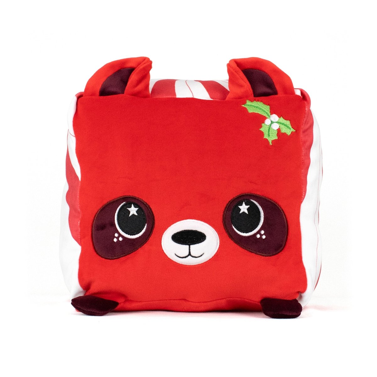 A red, square plush toy named Quincy the Raccoon with a cute raccoon face, large round eyes, top ears, and a small green holly near one ear. Plain white background.