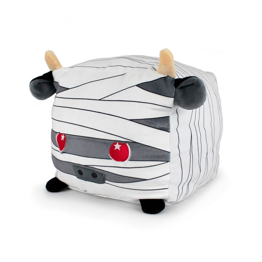 Ramsey the Sheep Mummy is a plush, cube-shaped toy with white fabric and gray stripes like mummy bandages. It features beige horns, red eyes, black nostrils, ears, and feet for a cute, wrapped-up look.