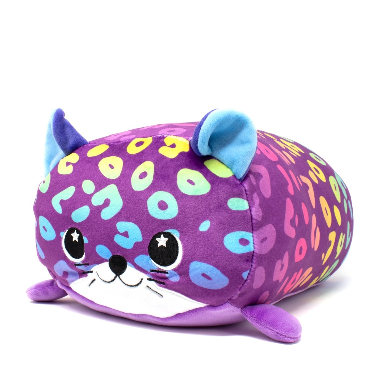 Rayn the Leopard Plushie is a brightly-colored toy with purple fur, multicolored spots, and blue ears. This adorable plushie has a cute embroidered face with starry eyes, a small nose, and an embroidered mouth and is displayed on a white background.