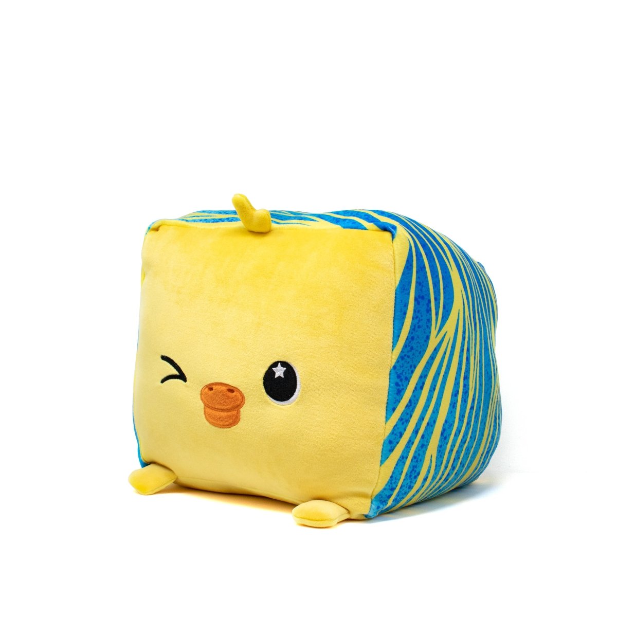 Rei the Duck Plushie is a cute, cube-shaped stuffed animal with a yellow body and blue swirly patterns, featuring a playful expression—a winking eye, blushing cheeks, and an embroidered star on its face.