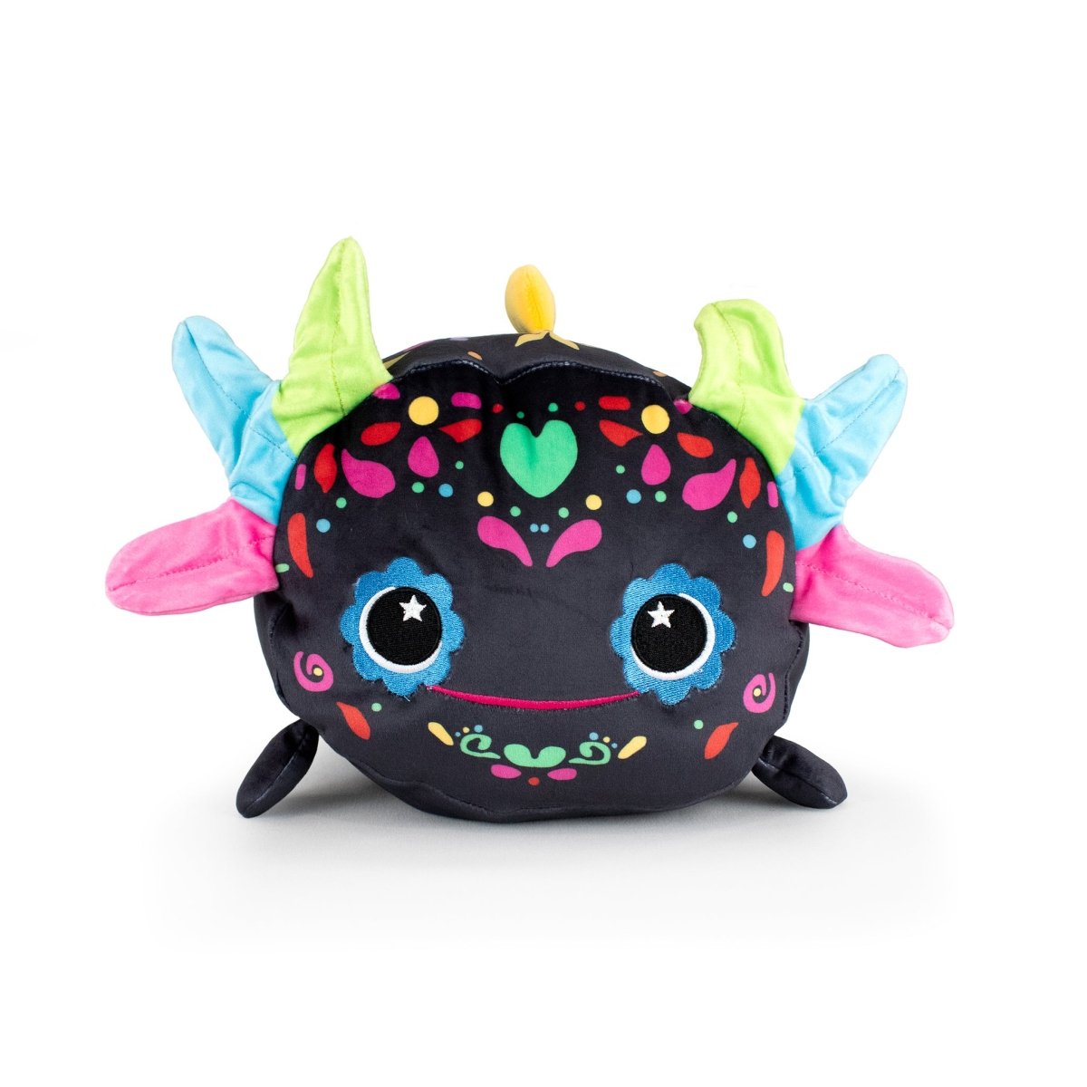 Reina the Axolotl is a cuddly plush toy with a black body, large blue eyes, vibrant patterns, and multicolored horns in green, blue, and pink, resembling a whimsical creature, shown against a white background.