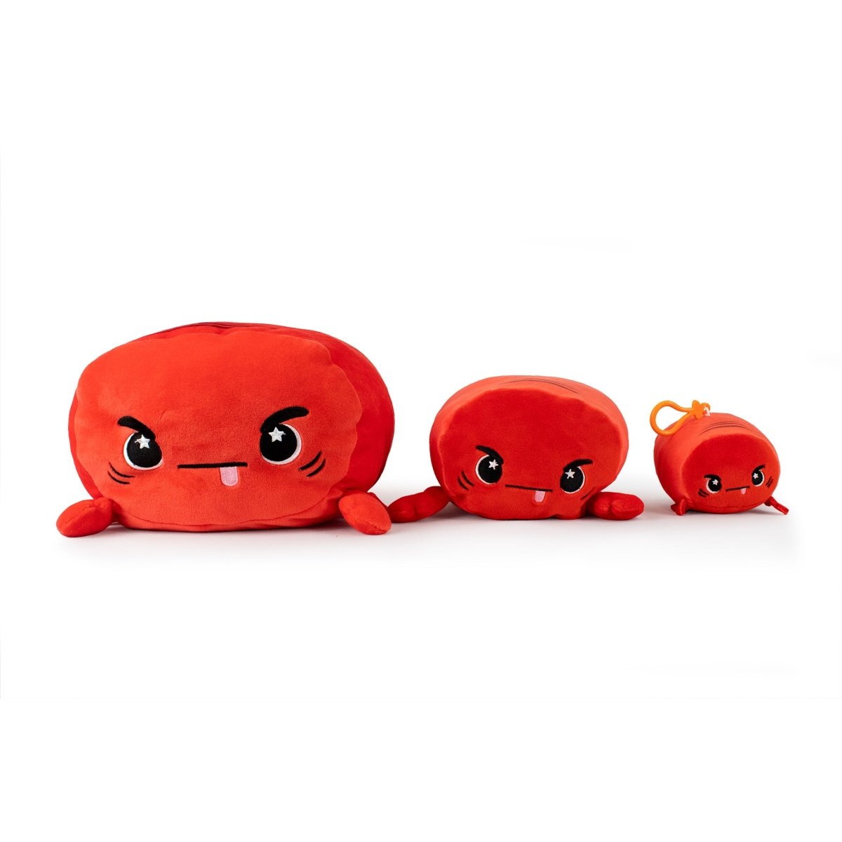 From the Moosh-Moosh Series, these three red plush toys boast crab-like features with playful expressions. Sebbie the Crab leads with its tongue-out look, joined by a straight-mouthed toy and a frowning clip-on plushie, arranged largest to smallest from left to right.