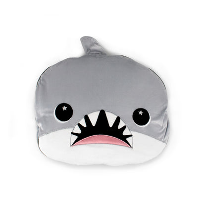 The 2-in-1 Pillow Blanket - Crush the Shark is a plush pillow shaped like a cartoon shark's face, with starry eyes, pointed teeth, a top fin, and gray, white, and pink details.