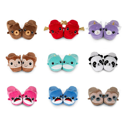 Nine pairs of Chunky Monkey Kids Slippers are arranged in three rows on a white background, featuring plush animal designs like bears, unicorns, monkeys, sloths, and more. These fun house slippers have non-slip soles for safety.