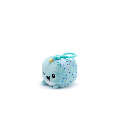 Poindexter the Narwhal Square Plush Clip-On from Moosh-Moosh Series 1 is a cute, cube-shaped plush with a smiling face, light blue body, and sprinkle patterns. Featuring a loop handle on top, this clip-on adds fun to your bag or keys.