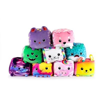 Nine adorable plushie toys, including Stella the Lion, with unique designs like a rabbit, shark, and unicorn. They have vibrant colors, friendly faces, and soft features arranged in a pyramid of three rows.