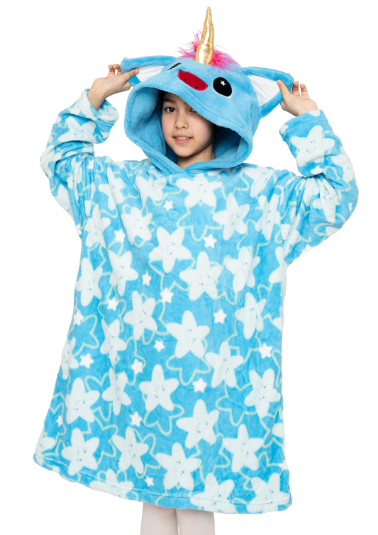A child smiles while holding up the hood of the Hooded Blanket - Sparkle the Unicorn, a blue oversized blanket with white starfish print and a unicorn face, ears, pink mane, and yellow horn on the hood.