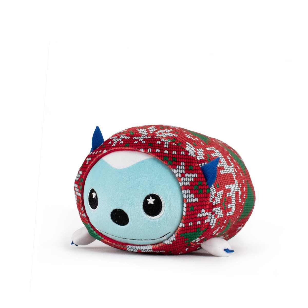 Artie the Yeti Slumber is a round, blue holiday plushie with small arms, legs, and blue ears. Featuring star-shaped eyes and a red-and-green snowflake sweater, this smiling plush is machine washable for easy care.