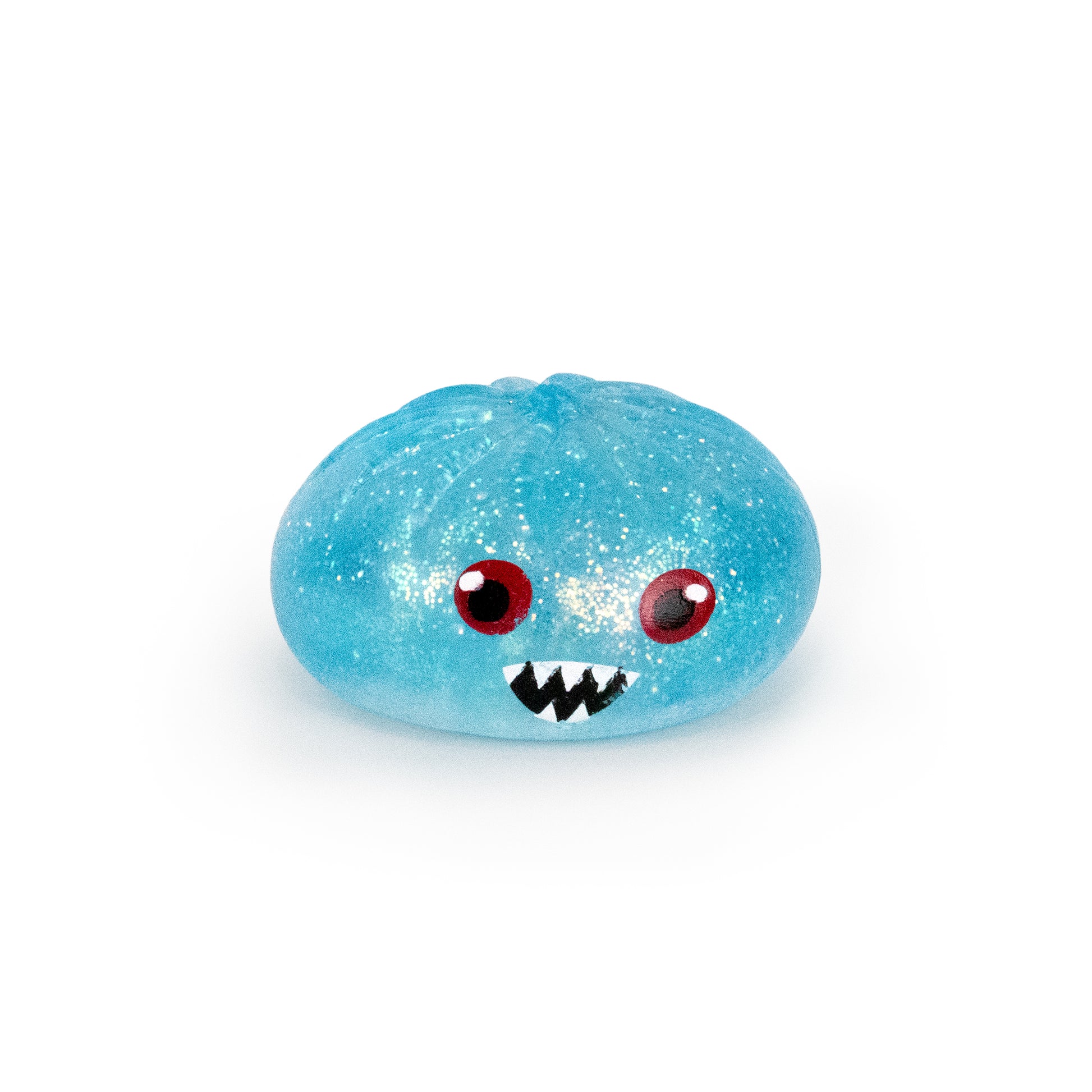 Bubblegum’s Favorite Toy - Spooky Mystery Dumpling is a round, blue, glittery toy featuring big red eyes and a cartoonish mouth with sharp white teeth, displayed on a white background.