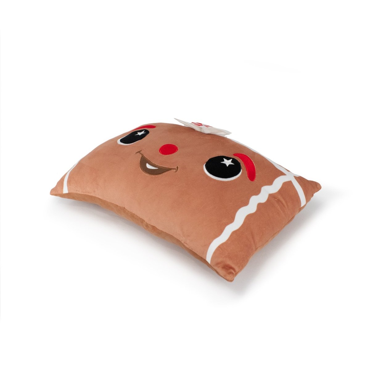 Melani the Gingerbread Pillow is a rectangular brown plush designed like a smiling cookie, with red cheeks, big black eyes, white icing-like edges—perfect for holiday décor or as a fun squishy sensory pillow.