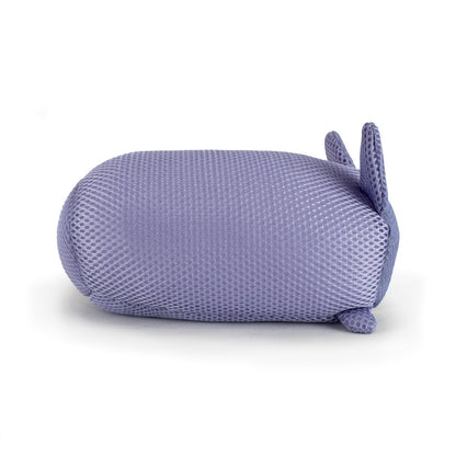 Aqua Moosh-Moosh Carrie is a soft, purple, mesh-textured plush toy shaped like an oval animal, lying on its side with small round feet, a tiny tail, and two upright ears.