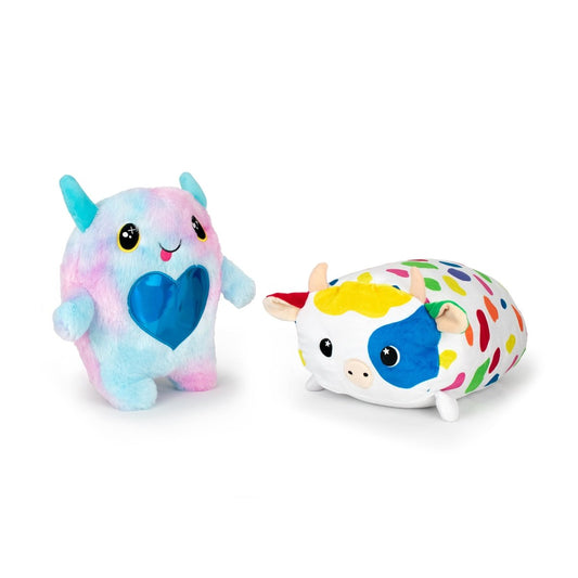 The Daisy and Cow Monstah Pair includes a pastel, horned plushie with a blue heart and big eyes, plus a round cow plushie with a blue eye spot and sprinkle-patterned body.