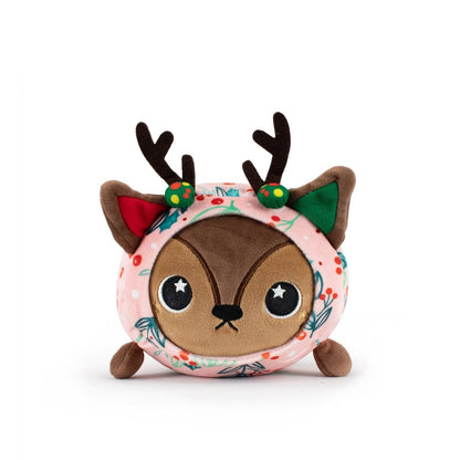 Mitzy the Reindeer Slumber is a round, plush toy with brown antlers, big black eyes, small legs, and a pink body adorned with green leaves and red berries—perfect as a holiday plush or Christmas gift.