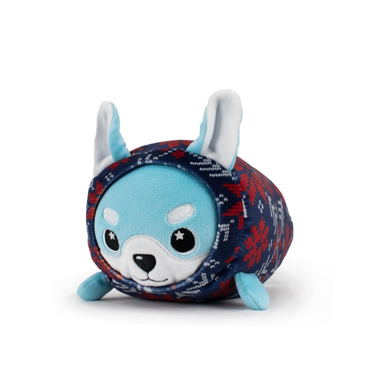 Yuki the Snowfox Slumber is a round, blue plush toy with large white ears, big black eyes, and a patterned blue and red sweater-like body—an irresistibly cuddly stuffed animal perfect as a holiday plush.