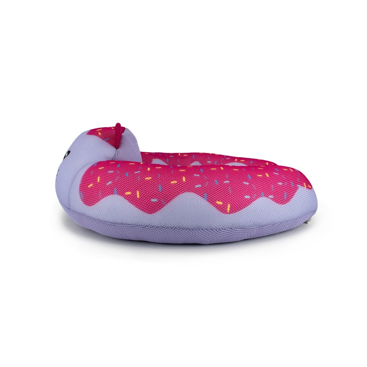 The Freckles Crescent 23" Aqua Plush is a donut-shaped pet bed with a pink top, colorful sprinkles, an animal face, and quick-dry plushie material. The base and sides are light purple, resembling a frosted donut.