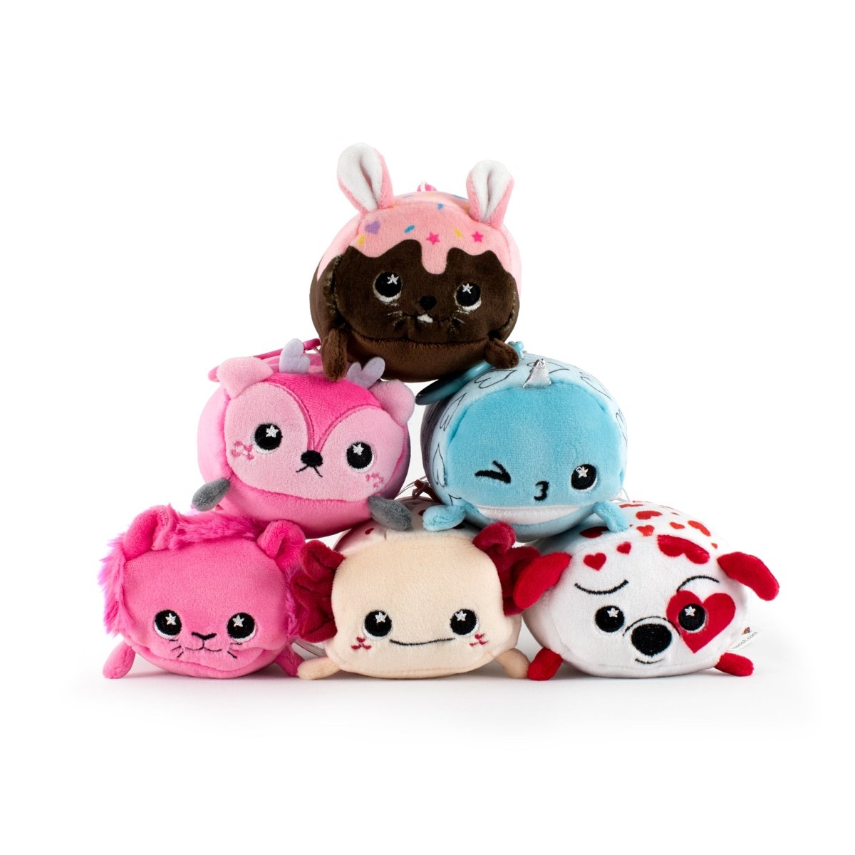 A plushie toy pyramid featuring vibrant colors and unique characters: a brown cupcake rabbit, Hershel the Narwhal (a pink animal with horns), a blue winking creature, a soft pink cat, a beige bear, and a white critter with red hearts.