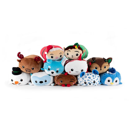 A group of plush toys, featuring Yuki the Snow Fox, a penguin, and an owl in festive attire, stacked in a pyramid on a white background.