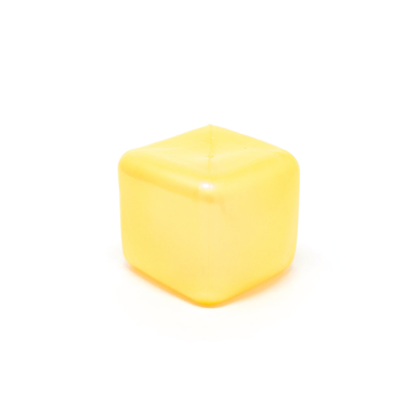 A single Sugah-mal Pearl Cube from Bubblegum’s Favorite Toy—a yellow, translucent, cube-shaped object with rounded edges—sits on a white background.