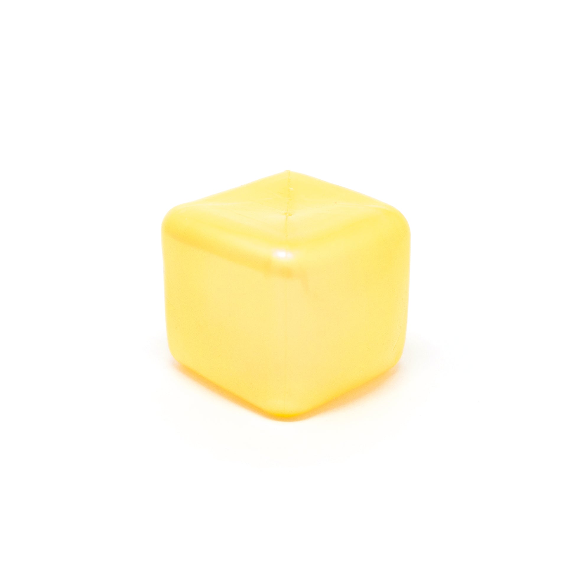 A single Sugah-mal Pearl Cube from Bubblegum’s Favorite Toy—a yellow, translucent, cube-shaped object with rounded edges—sits on a white background.