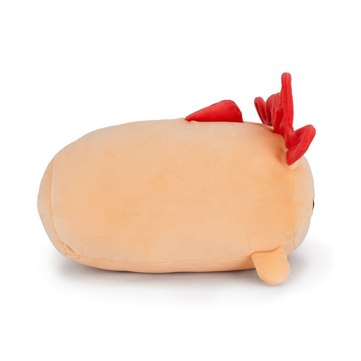 Pearl the Axolotl is a plush toy shaped like a light brown oval with small red spikes and a tiny beige fin, resembling a cute cartoon sea creature, shown lying on its side against a white background.