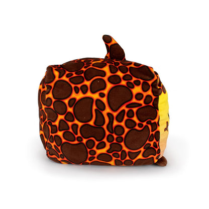 Pele the Lava Shark is an ultra-soft plush toy cube with a giraffe-like brown and orange pattern, a small tail on top, and a brown spot at one corner, shown against a white background.