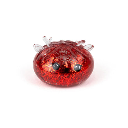 A squishy, red glittery Bubblegum’s Favorite Toy - Jr Reindeer Mystery Maltose Dumpling with small antlers and black eyes.