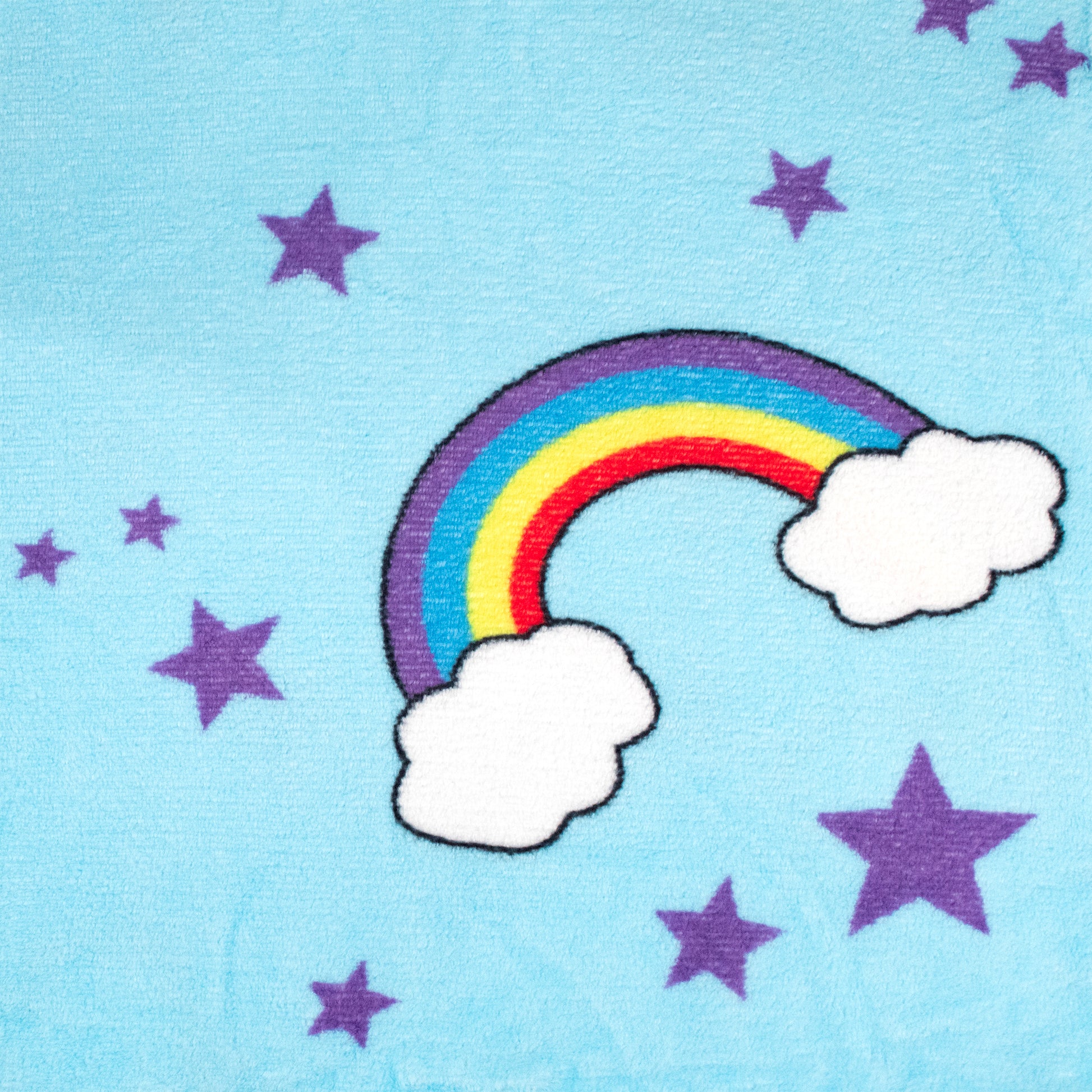A cartoon rainbow with white clouds sits on a light blue background with purple stars—creating a dreamy design on the 2-in-1 Pillow Blanket - Sparkle the Unicorn, perfect for kids to snuggle as a fleece blanket or Moosh-Moosh pillow.