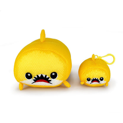 The Aqua Moosh-Moosh Dash set features two yellow plush toy sharks with cartoon faces—one large, one small—both with big eyes and toothy grins. The smaller shark comes with a handy yellow clip for easy attachment.