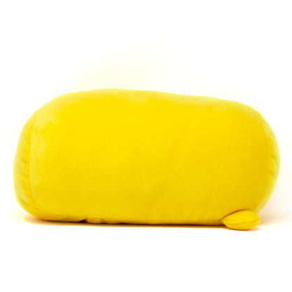 The plush toy, Carl the Baby Chicken Plushie, is long and oval-shaped like a yellow blob. It offers cozy cuddles with its smooth texture and features a small, flat extension resembling a foot or tail at the bottom right. Set against a plain white background, it's truly adorable.